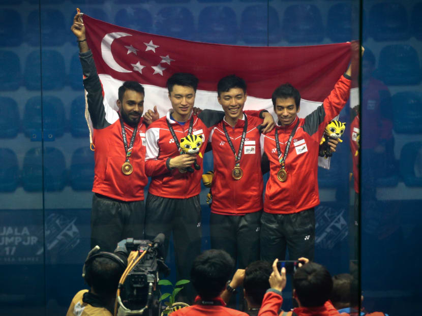 The Singapore mens squash team pose with their gold medals after competing against The Philippines in the SEA Games mens squash team finals on August 29, 2017. Photo: Jason Quah/TODAY