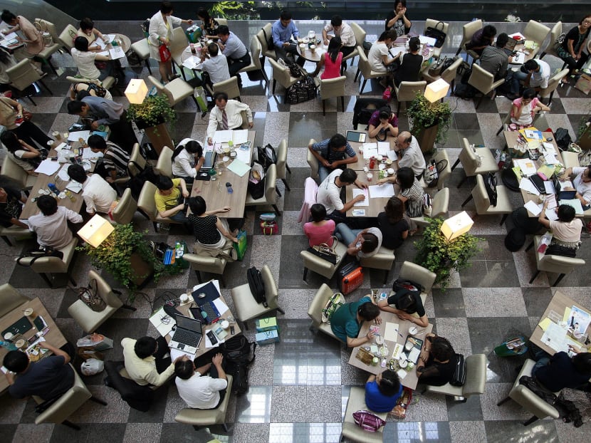 Office workers at a cafe in Taipei. Analysts warn Taiwan will face a tough challenge staunching what  brain drain and exodus of investment to China after Beijing’s latest offer of economic sweeteners to lure Taiwanese. Photo: Reuters