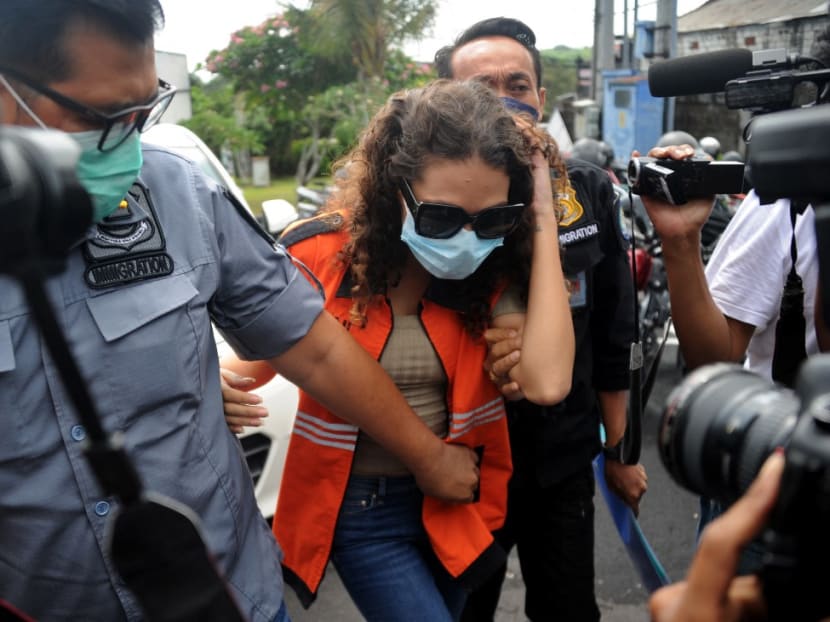 Heather Mack of the US is escorted by immigration guards to the immigration detention house in Jimbaran, on the resort island of Bali on Oct 29, 2021.