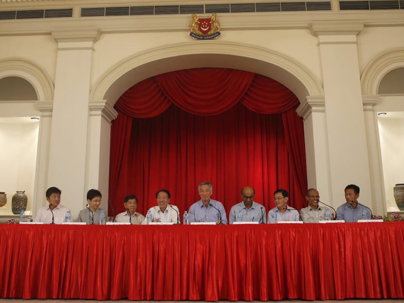 Prime Minister Lee Hsien Loong (centre) announces the new cabinet at a press conference at the Istana. Photo: Ernest Chua/TODAY