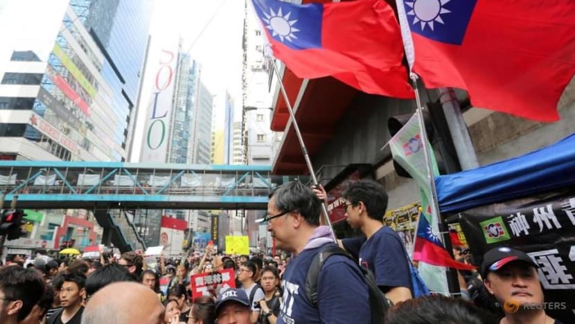 Many in Hong Kong, fearful of China's grasp, flee to Taiwan