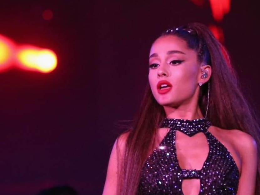 Ariana Grande falls on stage during concert, laughs it off as things 'going too well'