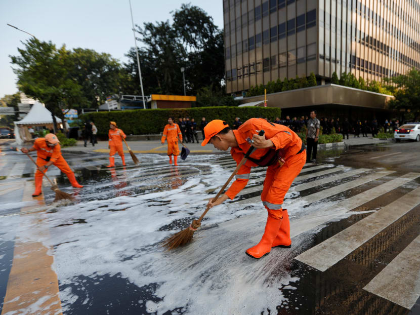 Photo of the day: Workers clean the road after a riot outside Indonesia's election supervisory agency headquarters following the announcement of last month's presidential election results in Jakarta, on May 23, 2019.