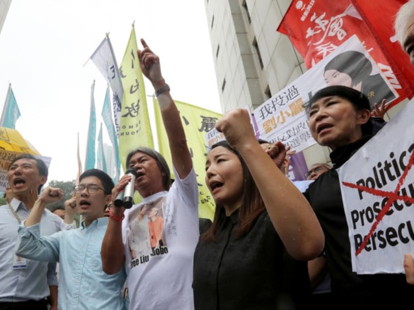 Hong Kong court ousts four lawmakers
