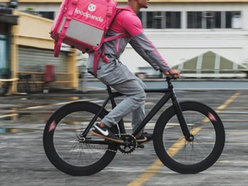 A Foodpanda delivery rider makes his rounds on a bicycle. The court heard that Muhammad Adli Adi had taken both hands off his bicycle's handlebars to reply to an Instagram message prior to the collision.
