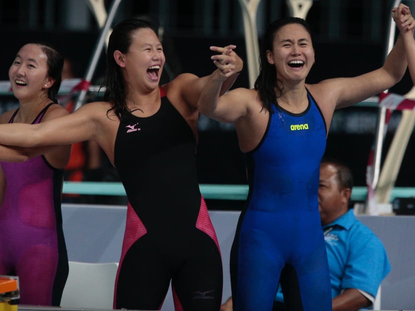 Quah Jing Wen, Christie Chue, Quah Ting Wen and Rachel Tseng react after winning the SEA Games womens 4x200m freestyle relay. Photo: Jason Quah/TODAY