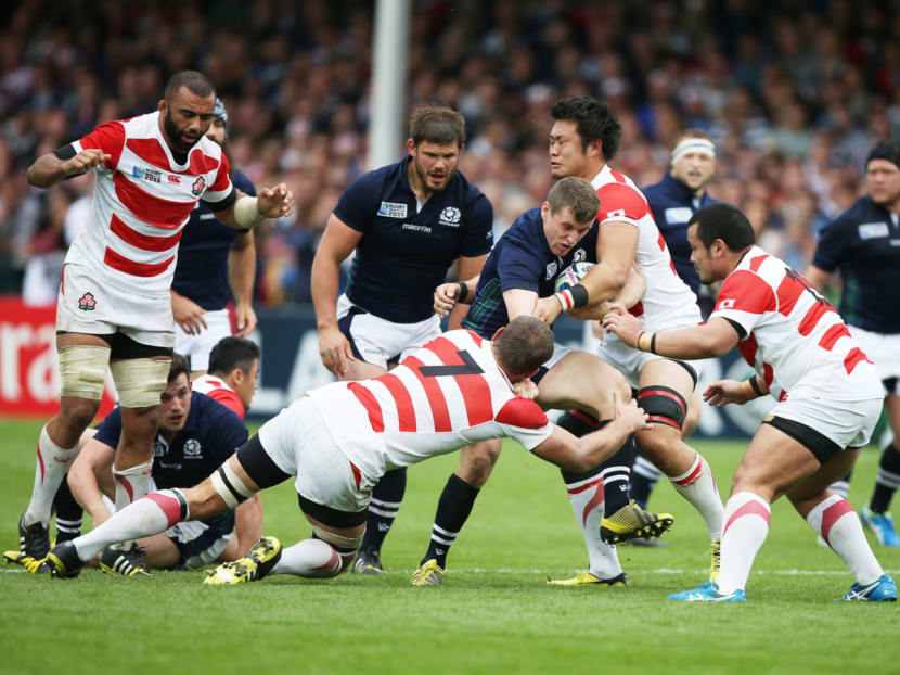 Could Japan (in red and white) have beaten Scotland if they had been better rested? Photo: Getty Images