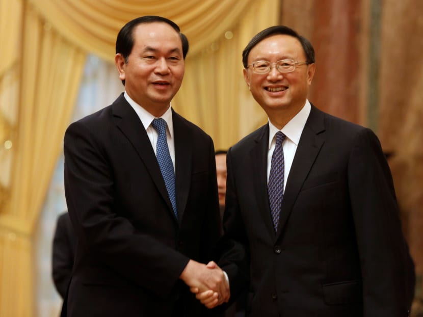 Vietnam's President Tran Dai Quang (L) meeting China's State Councilor Yang Jiechi at the Presidential Palace in Hanoi in June. Photo: Reuters