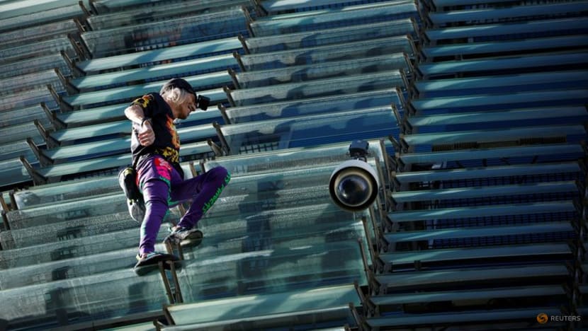 French Spiderman' climbs first skyscraper with son in Barcelona - CNA