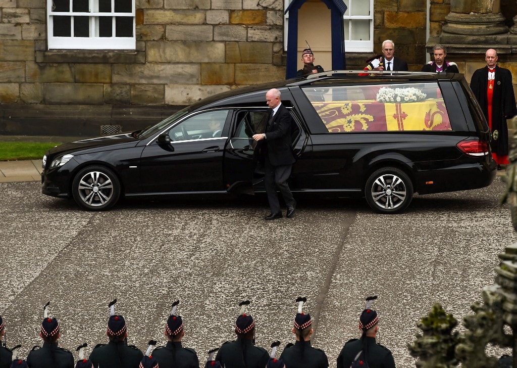 The hearse carrying the coffin of the late Queen Elizabeth II, draped with the Royal Standard of Scotland, arrives at the Palace of Holyroodhouse, in Edinburgh on Sept 11, 2022. The hearse carrying the coffin of the late Queen Elizabeth II, draped with the Royal Standard of Scotland, arrives at the Palace of Holyroodhouse, in Edinburgh on Sept 11, 2022.