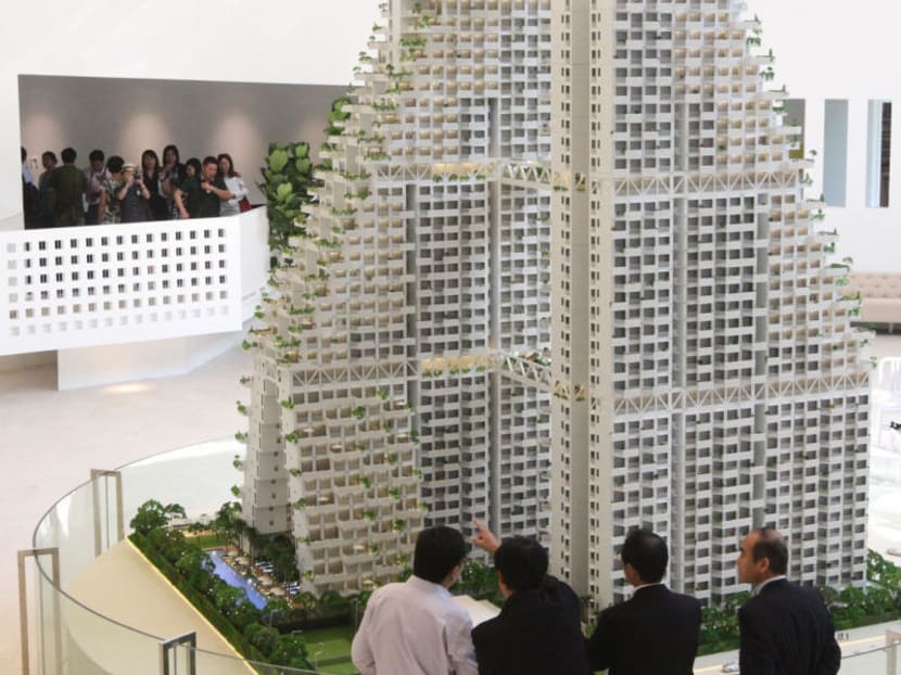 Visitors to the Sky Habitat show gallery at Bishan St 14 look at a model of the condominium on April 5, 2012. TODAY file photo