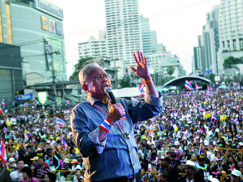 Mr Suthep, addressing supporters yesterday in Bangkok. The protest has raised the stakes in a long-running crisis and fuelled fears of more bloodshed to come. PHOTO: AP