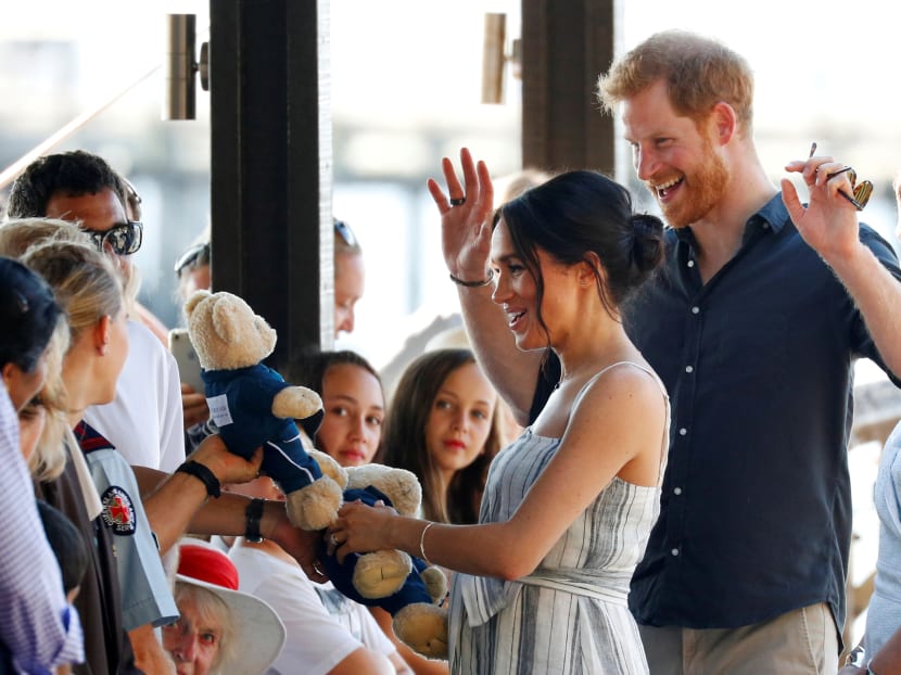 Photo of the day: Britain's Prince Harry and Meghan, Duchess of Sussex, receive teddy bears as they greet members of the public in Kingfisher Bay on Fraser Island in Queensland, Australia on October 22, 2018.