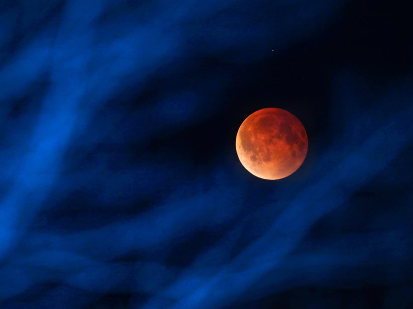 Gallery: Sky-watchers see ‘blood moon’ in total lunar eclipse