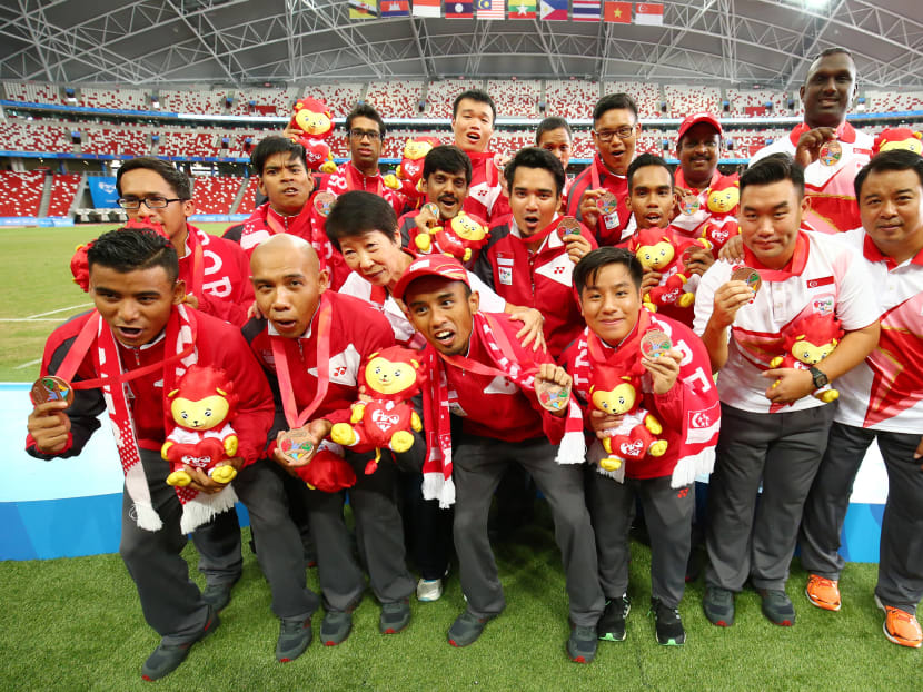 The Singapore players show off their medals after defeating Malaysia 2-1. Photo: Sport Singapore / Action Images via Reuters