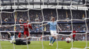 Leaders Arsenal respond in style after Man City thrash Liverpool