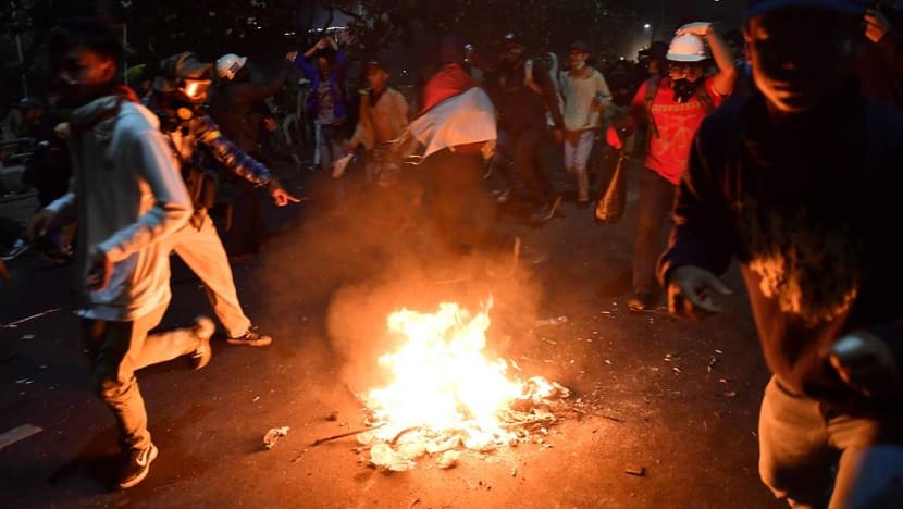 Clashes erupt even as Indonesia delays vote on major legal reforms Clashes erupt even as Indonesia delays vote on major legal reforms