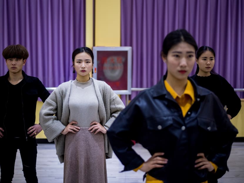 This picture taken on March 14, 2017 shows Jiang Mengna (2nd L) attending a dance class at the Yiwu Industrial & Commercial College in Yiwu, east China's Zhejiang Province. Photo: AFP
