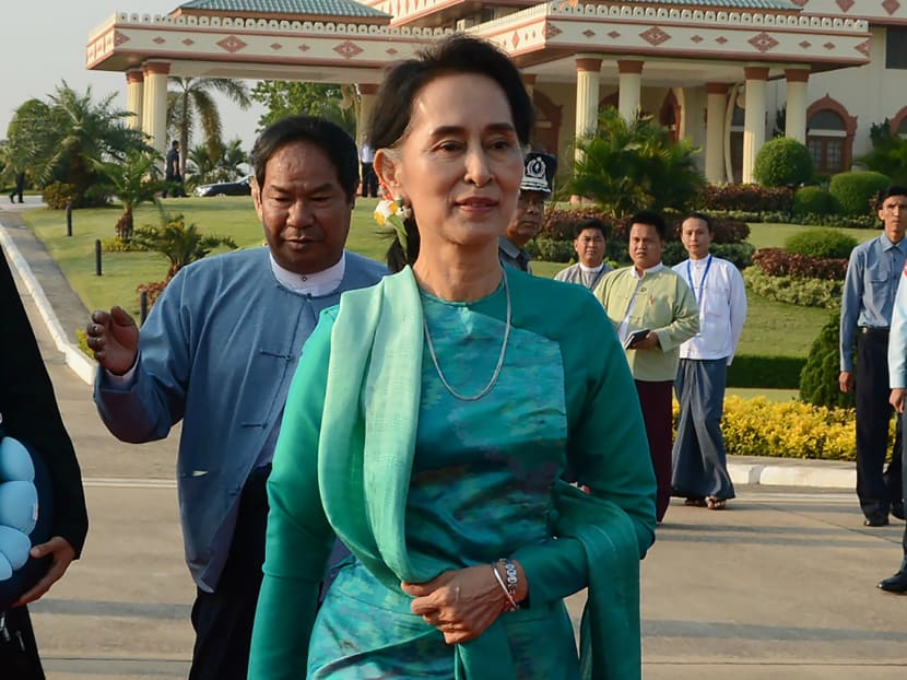 Myanmar State Counsellor and Foreign Minister Aung San Suu Kyi prepares to depart with President Htin Kyaw (not pictured) for an official trip to Laos from the Naypyidaw city airport. Photo: AFP