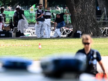French forensic police officers work at the scene of a stabbing attack in the 'Jardins de l'Europe' park in Annecy, in the French Alps, on June 8, 2023.