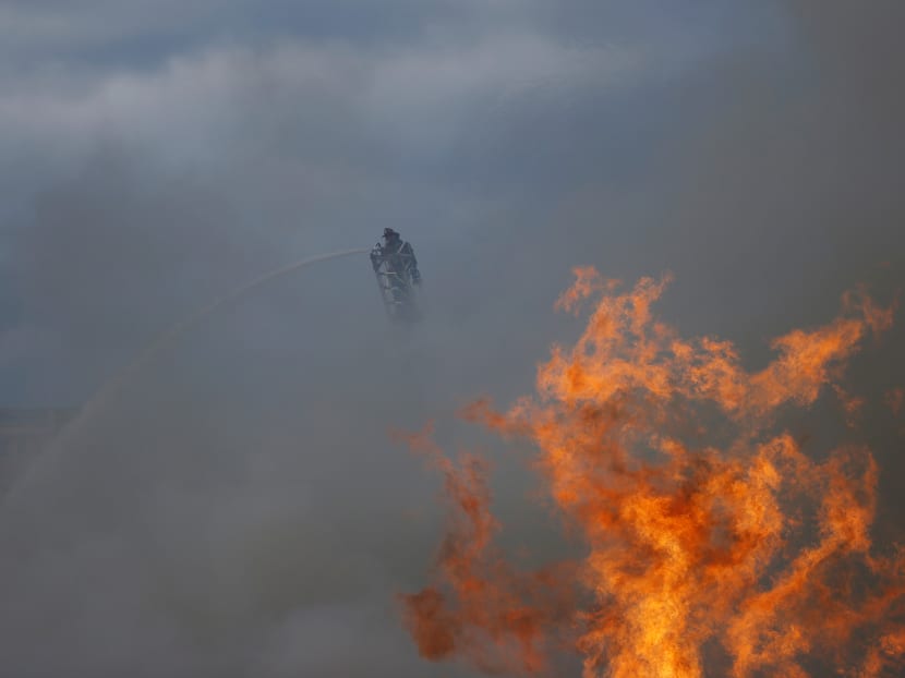Photo of the day: A firefighter battles a blaze sparked by a ruptured gas line in San Francisco, California, on Feb 6, 2019.