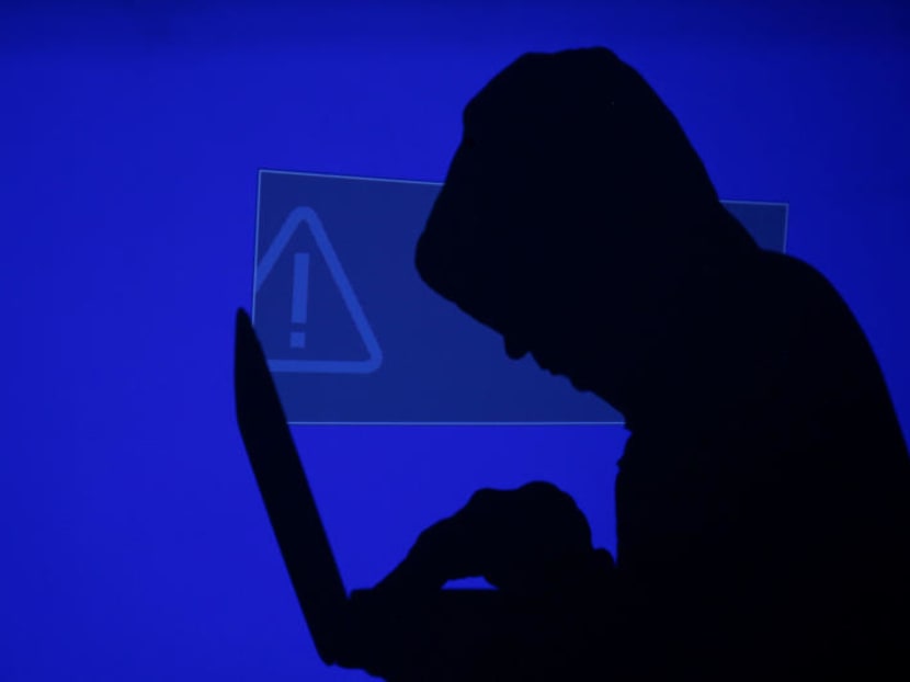 Capitalizing on spying tools believed to have been developed by the U.S. National Security Agency, hackers staged a cyber assault with a self-spreading malware that has infected tens of thousands of computers in nearly 100 countries - including Singapore. REUTERS