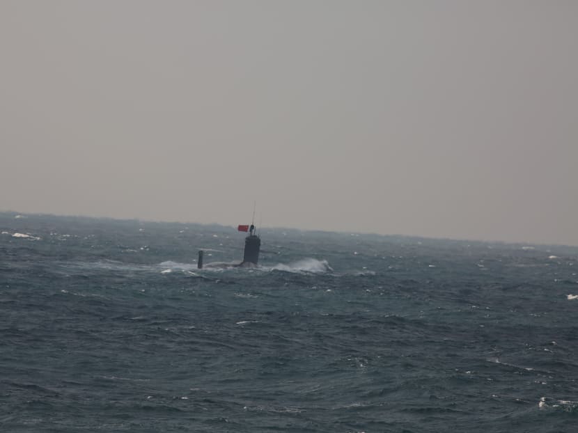 China's submarine sailing in the East China Sea is seen in this photo released by Japan's Ministry of Defence. Some military experts believe the vessel was forced to surface, but others say there is not enough information to back up that theory. Photo: Reuters
