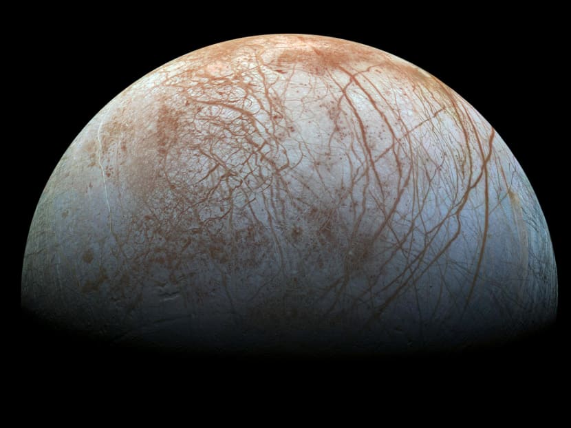 This NASA image obtained November 22, 2014 shows a global color view of the surface of Jupiter's icy moon Europa in this newly-reprocessed color view, made from images taken by NASA's Galileo spacecraft in the late 1990s. Photo via AFP