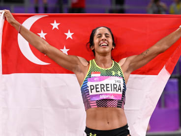 Singapore’s Shanti Pereira celebrates winning the women's 200m final at the Asian Games in Hangzhou on Oct 2, 2023.