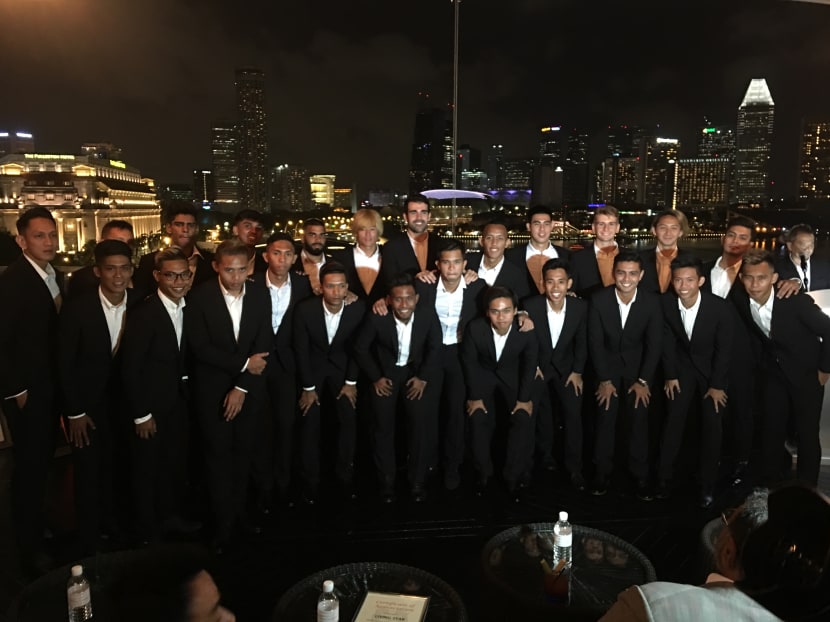 This season, Hougang United players and officials will turn up at televised games as well as away games in black formal suits, while they will wear a white shirt and black trousers for home games. Photo: Noah Tan/TODAY