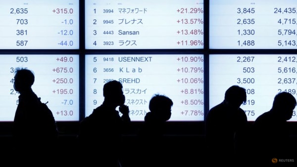Asia shares slip, Fed flags higher rates for longer