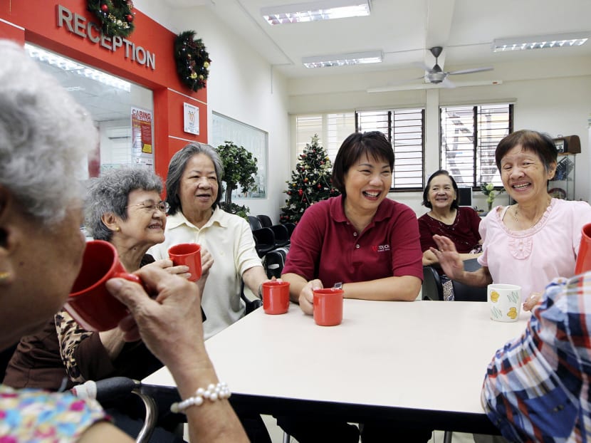 Ms Julia Lee (centre) chatting with a group of senior citizens at the TOUCH Seniors Activity Centre in Geylang Bahru. Photo: Ooi Boon Keong