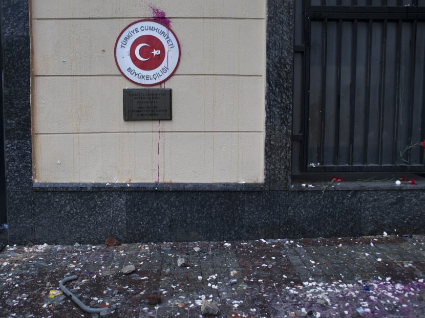 The pavement in front of the Turkish Embassy is covered with shattered glass and pieces of plaster after a protest in Moscow, Russia,  Wednesday, Nov. 25, 2015. Photo: AP