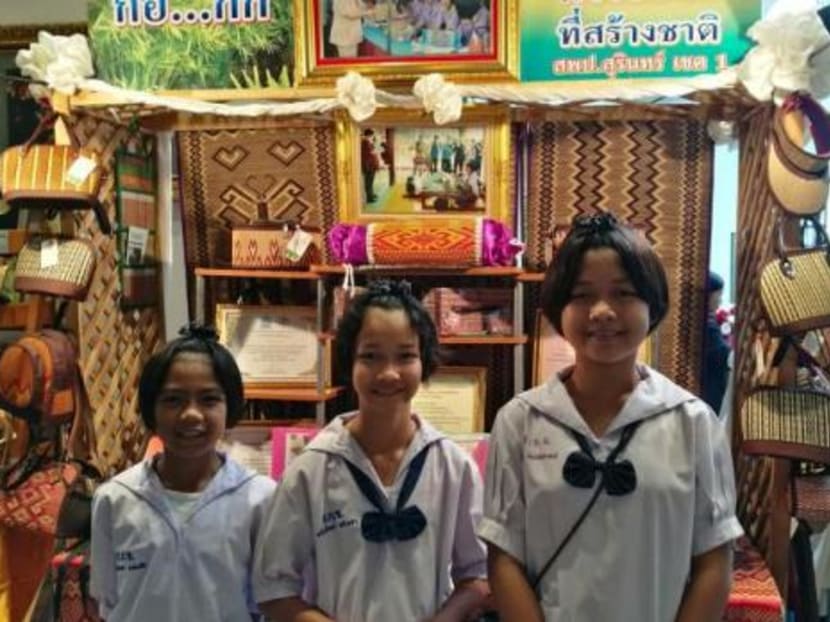Schoolgirls from Surin's Ban Kwang School take a photo with the handicrafts they produced using water hyacinths. They were among the finalists in this year's young innovative entrepreneur project award. Photo: Bangkok Post