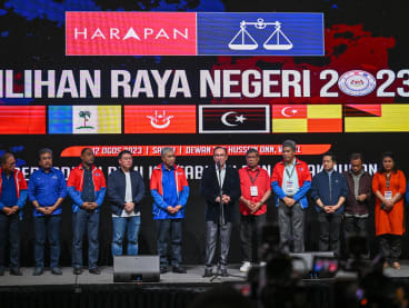 Malaysia's Prime Minister Anwar Ibrahim (centre) speaks during a press conference after the release of state election results at the World Trade Centre in Kuala Lumpur on Aug 12, 2023. 
