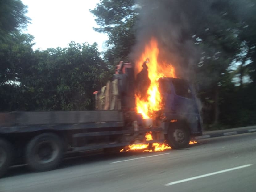 A lorry caught fire during the rush hour commute on Lornie Road on Tuesday (Sept 5) morning, causing a traffic jam that extended to Braddell Road. Photo: Lee Xin Li