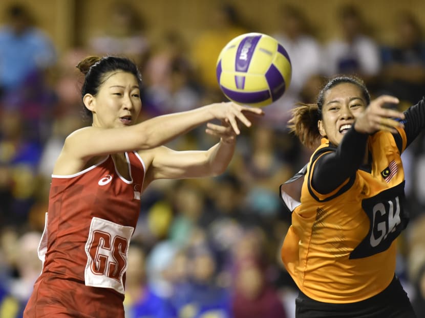 Singapore's Charmaine Soh (in red) in action in the SEA Games preliminary round match between Singapore and Malaysia at the Juara Stadium. Photo courtesy of Ben Cho/Sport Singapore