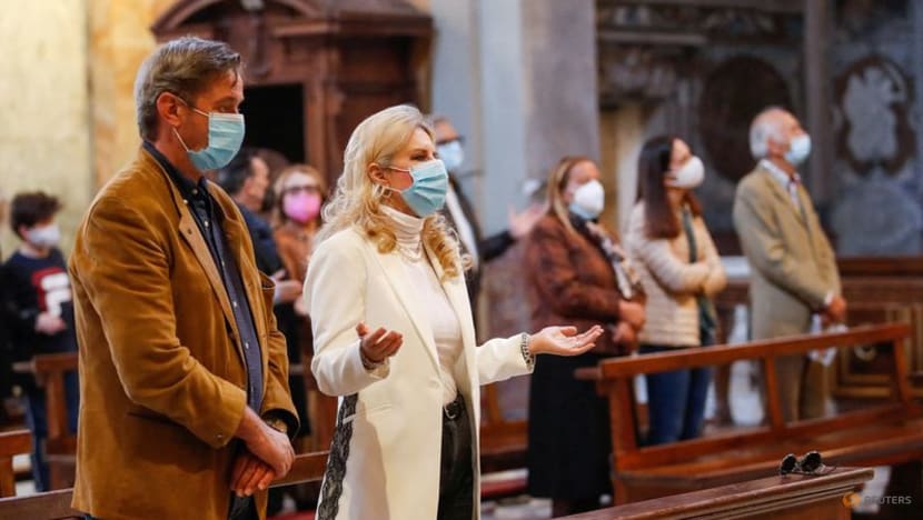 Italy's Catholic Church reintroduces handshakes during Mass Italy's Catholic Church reintroduces handshakes during Mass