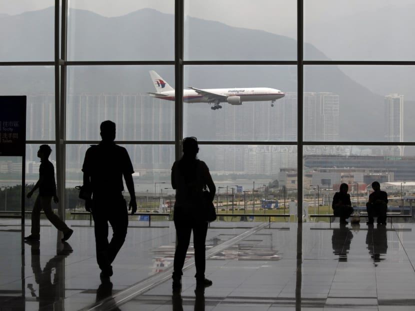 A Malaysia Airlines Boeing 777 plane is seen from the departure hall at the Hong Kong International Airport. Photo: Reuters