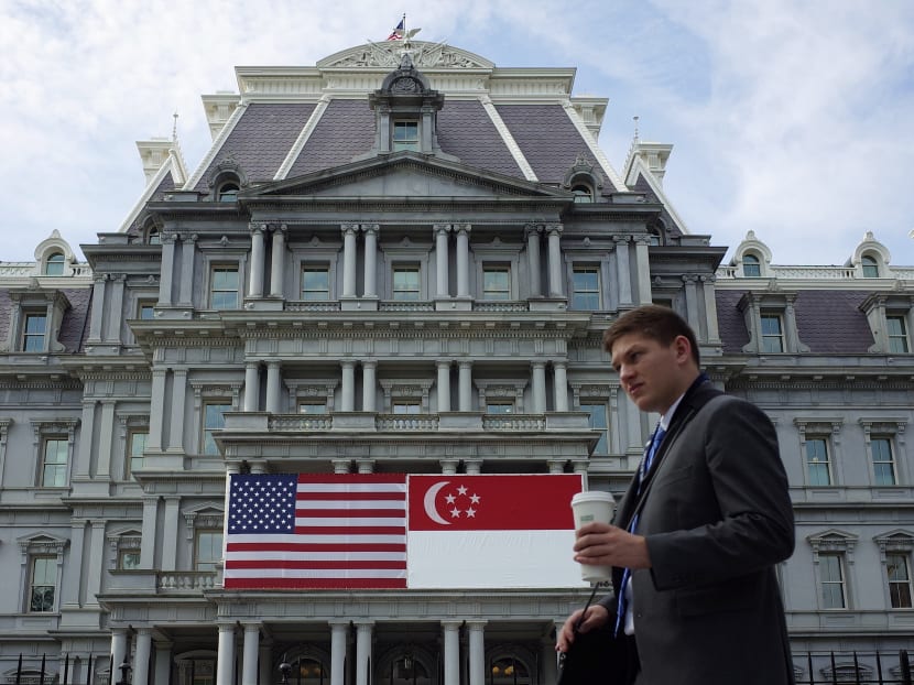 The Eisenhower Executive Office Building, next to the White House, adorned with the US and Singapore flags on July 28, 2016 in Washington, DC. AFP file photo