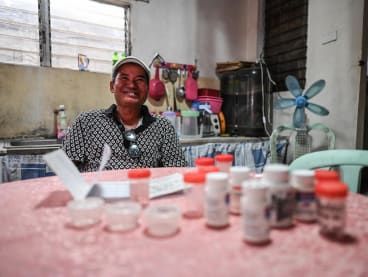 In this photo taken on Jan 18, 2024, Mr Efifanio Brillante, a patient for the BPaL regimen for the drug resistant tuberculosis, shows the bottles of medicines used for his treatment at his home in Orani, Philippines. 
