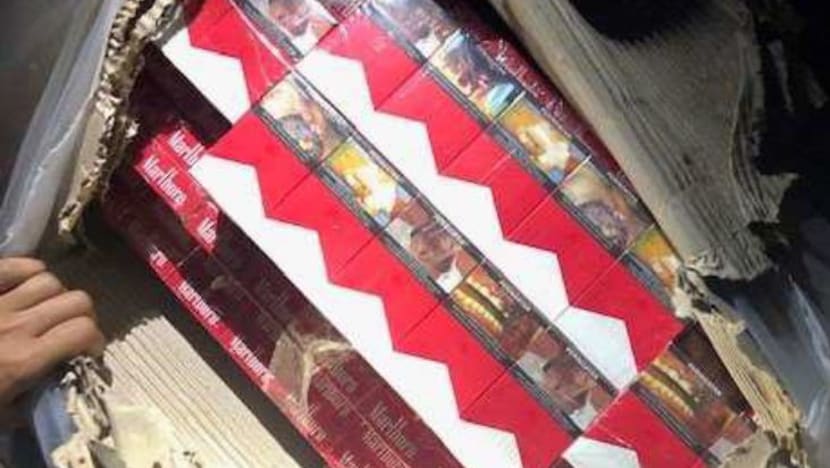 11,000 cartons of duty-unpaid cigarettes hidden inside paper rolls seized at Woodlands Checkpoint 11,000 cartons of duty-unpaid cigarettes hidden inside paper rolls seized at Woodlands Checkpoint