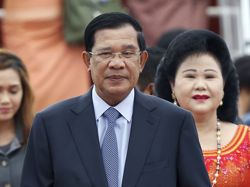 Cambodia's Prime Minister Hun Sen and his wife Bun Rany arrive for the 27th Association of Southeast Asian Nations (ASEAN) summit, in Sepang, Malaysia. Photo: AP