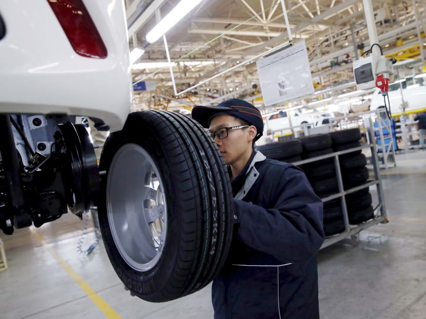 An employee at a car assembly line in Beijing. Reuters file photo