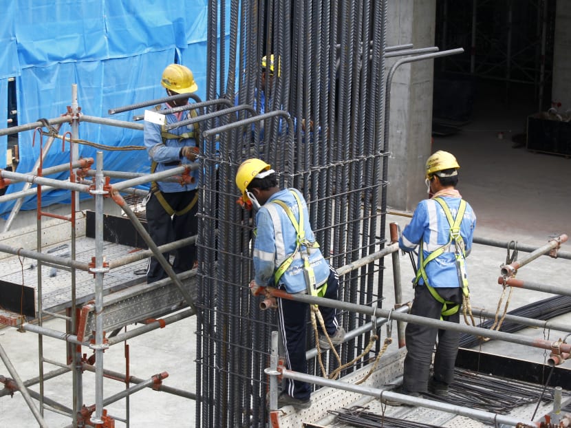 Construction workers working at a construction site. TODAY file photo