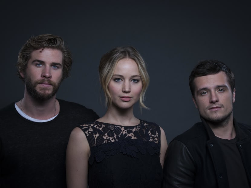 Co-starring in "The Hunger Games: Mockingjay - Part 1" from left, actors Liam Hemsworth, Jennifer Lawrence and Josh Hutcherson pose for a portrait on Saturday, Nov. 15, 2014 in New York. Photo: AP