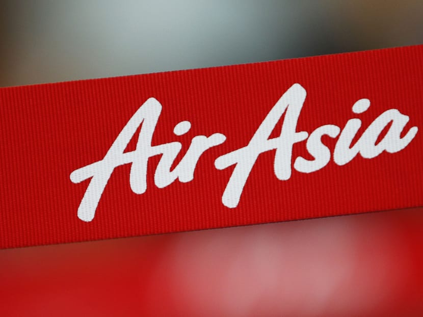 An AirAsia sign is pictured at its check-in counter at Changi Airport in Singapore Dec 28, 2014. Photo: Reuters