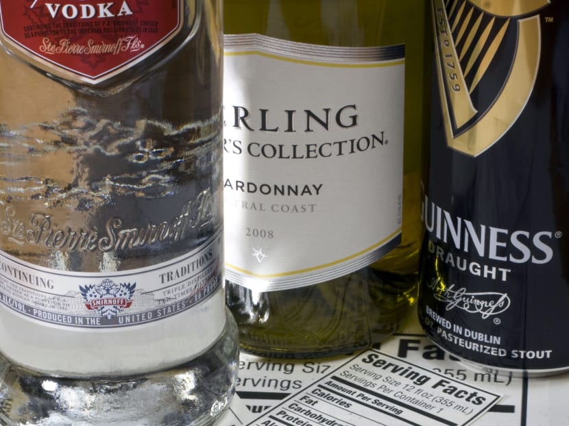 In this Jan 16, 2011 file photo, bottles of vodka, wine and beer sit alongside proposed nutrition labels in Concord, N.H. Photo: AP