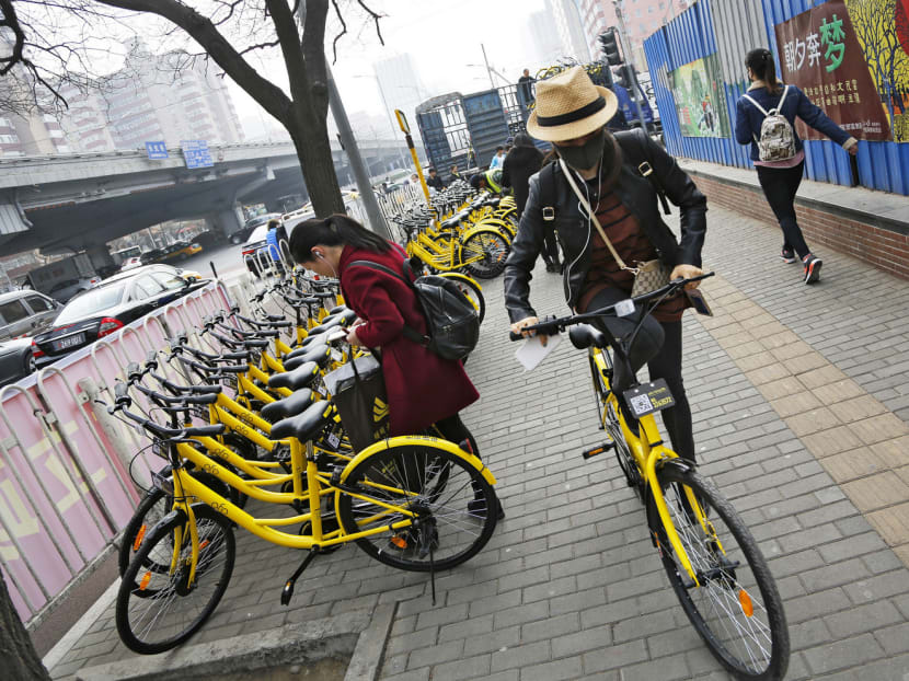 Commuters in Beijing using ofo bicycles. Bike-sharing operators in Singapore use a dockless system, which can present challenges in a compact and orderly city. Photo: AP