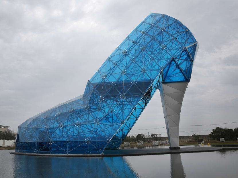 This Jan 28, 2016 photo shows a giant glass structure shaped like a high-heel shoe being built as a wedding hall in southern Chiayi, Taiwan. Photo: AP